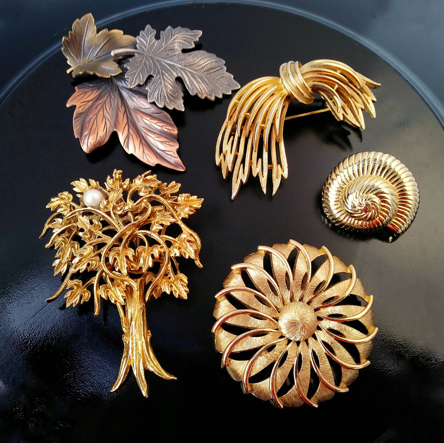 five vintage brooches by Monet, Lisner, Danecraft