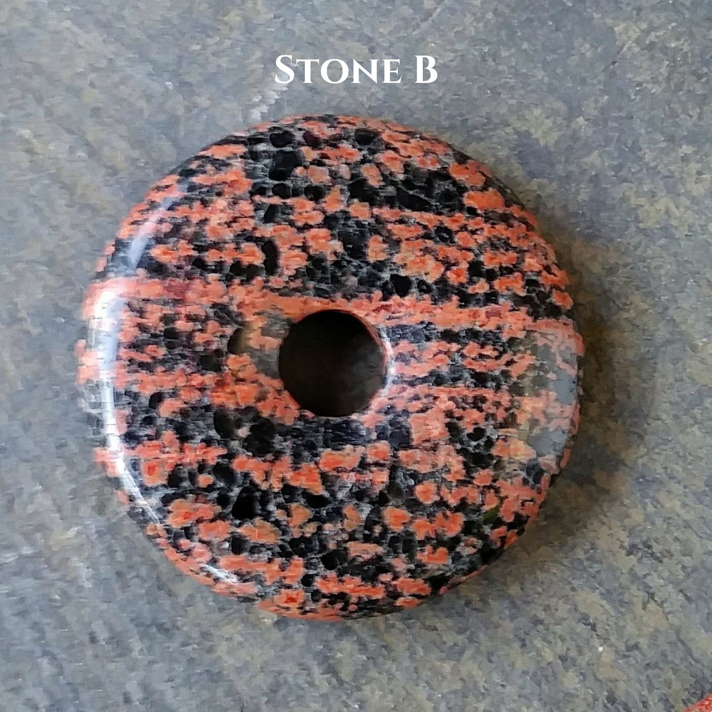 40mm Red Snowflake Jasper Stone Donut on black waxed cotton cord