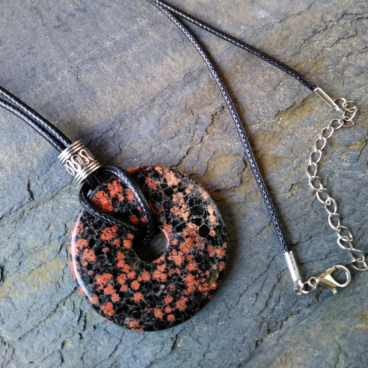40mm Red Snowflake Jasper Stone Donut on black waxed cotton cord